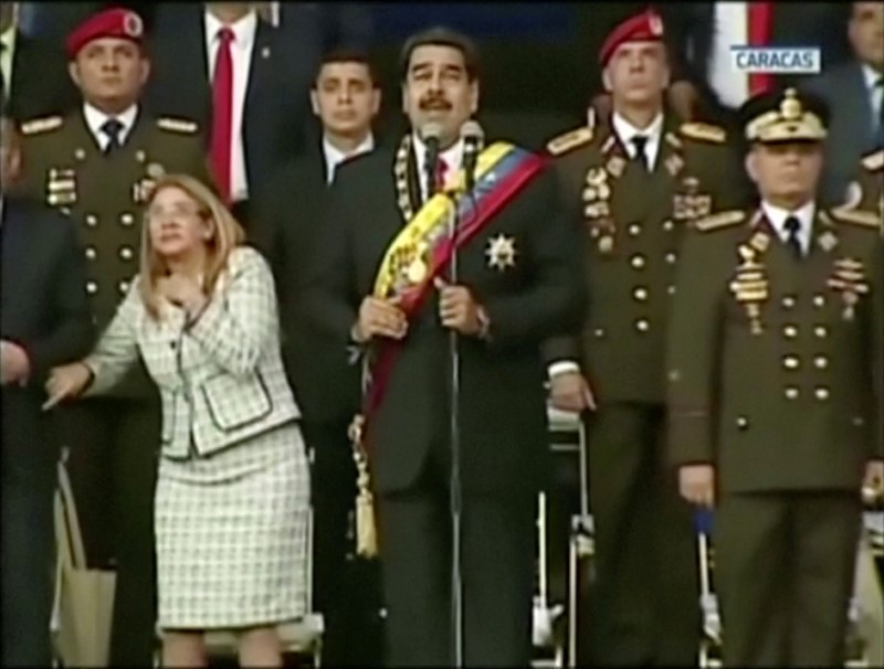 Venezuelan President Nicolas Maduro reacts during an event which was interrupted, in this still frame taken from video
