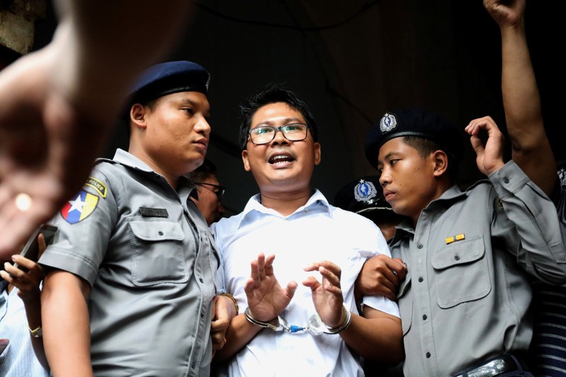 FILE PHOTO: Reuters journalist Wa Lone departs Insein court after his verdict announcement in Yangon