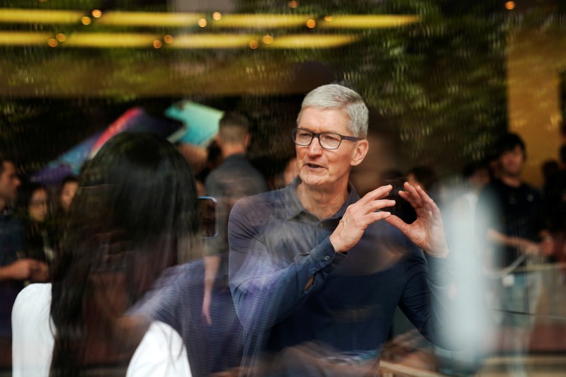 Apple CEO Tim Cook attends an Apple store in Shanghai