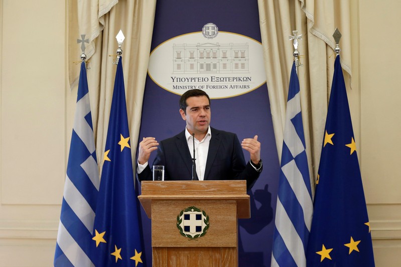 Newly appointed Greek Foreign Minister and Prime Minister Alexis Tsipras delivers a speech during a hand over ceremony at the Foreign Ministry, in Athens