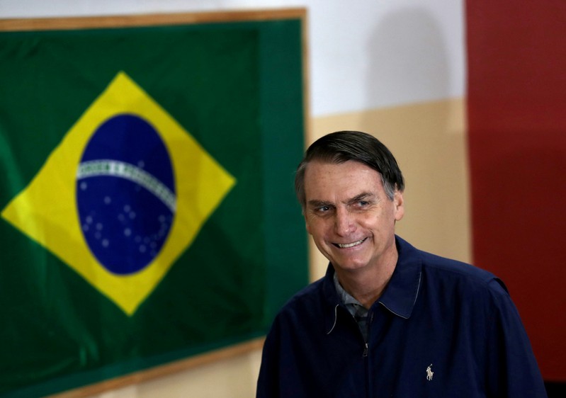 FILE PHOTO: Jair Bolsonaro, far-right lawmaker and presidential candidate of the Social Liberal Party (PSL), arrives to cast his vote in Rio de Janeiro
