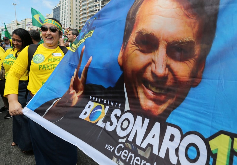 A supporter of Jair Bolsonaro, far-right lawmaker and presidential candidate of the Social Liberal Party (PSL), attends a demonstration in Rio de Janeiro