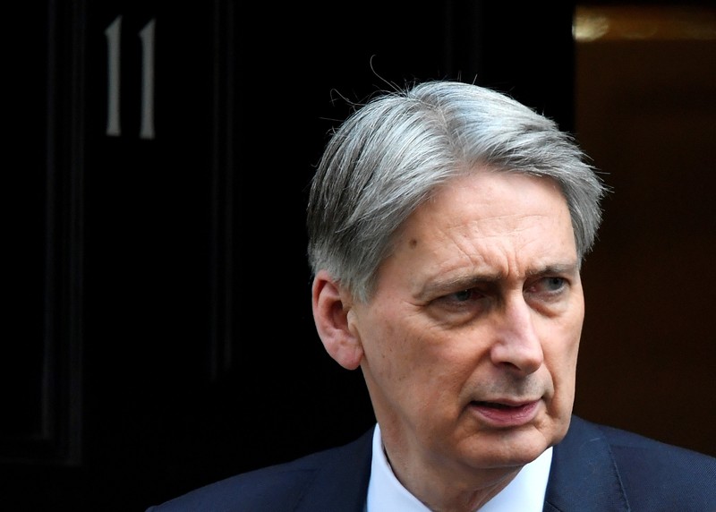 FILE PHOTO: Britain's Chancellor of the Exchequer Philip Hammond, leaves 11 Downing Street in London