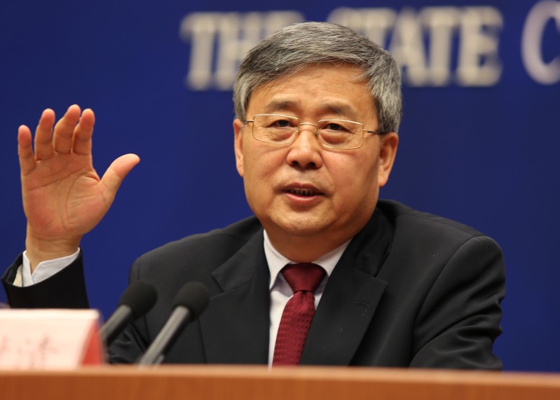 Guo Shuqing, China's newly appointed banking regulator, attends a news conference ahead of China's parliament in Beijing