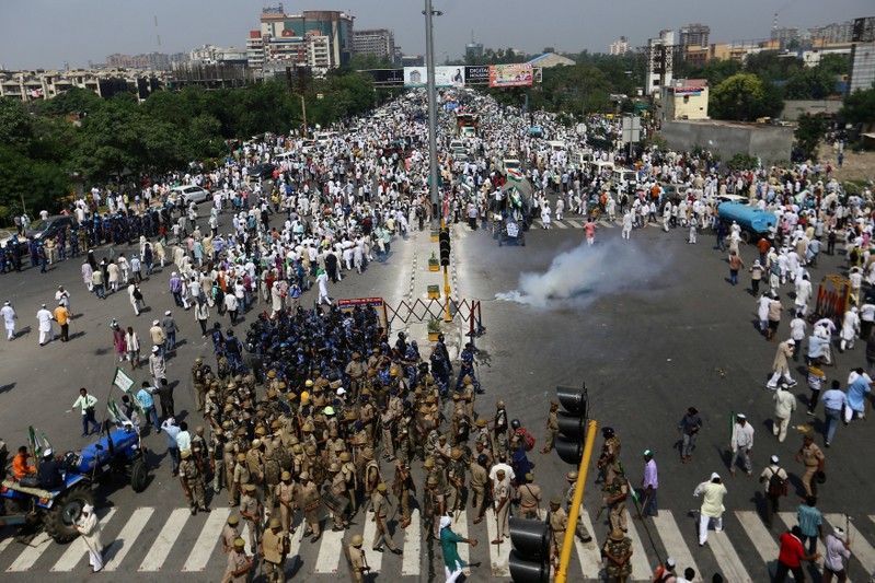 FILE PHOTO: Police try to stop farmers during a protest demanding better price for their produce on the outskirts of New Delhi