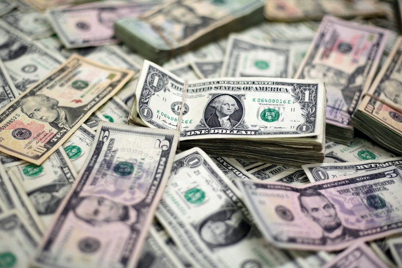 U.S. Dollar banknotes are seen in this photo illustration