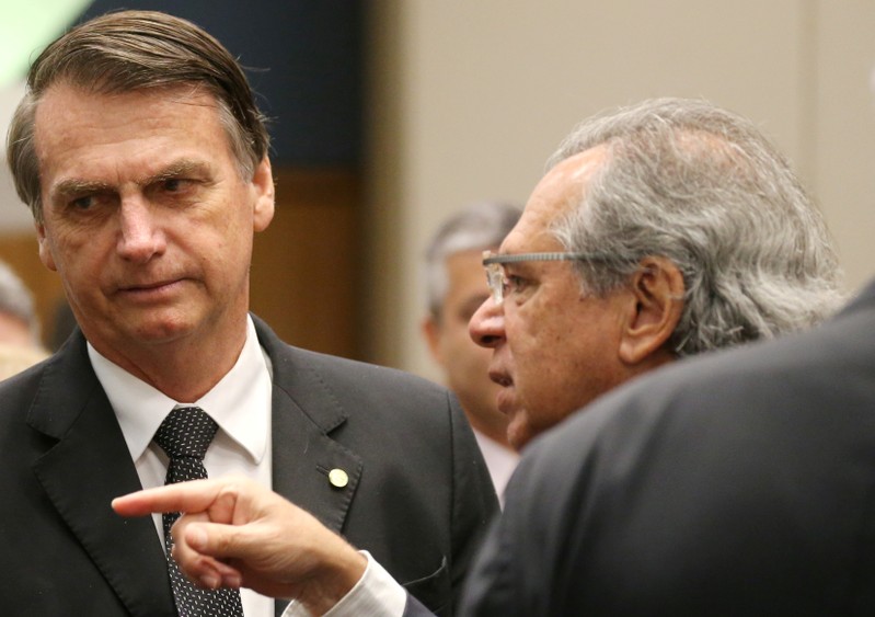 Federal deputy Bolsonaro a candidate for the Presidency of the Republic for the PSL listens to economist Paulo Guedes before a lunch with businessmen at the FIRJAN headquarter in Rio de Janeiro