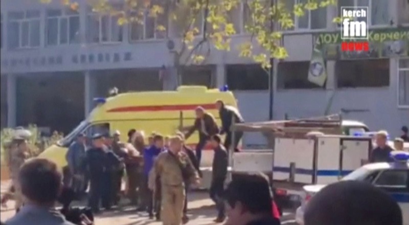 A still image taken from a video shows emergency services carry an injured victim of a blast at a college in the Crimean city of Kerch