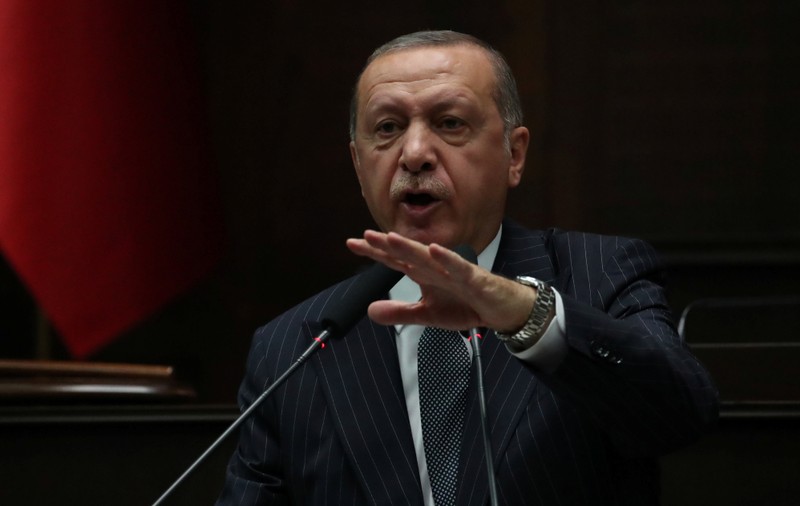 Turkish President Tayyip Erdogan addresses members of parliament from his ruling AK Party during a meeting at the Turkish parliament in Ankara