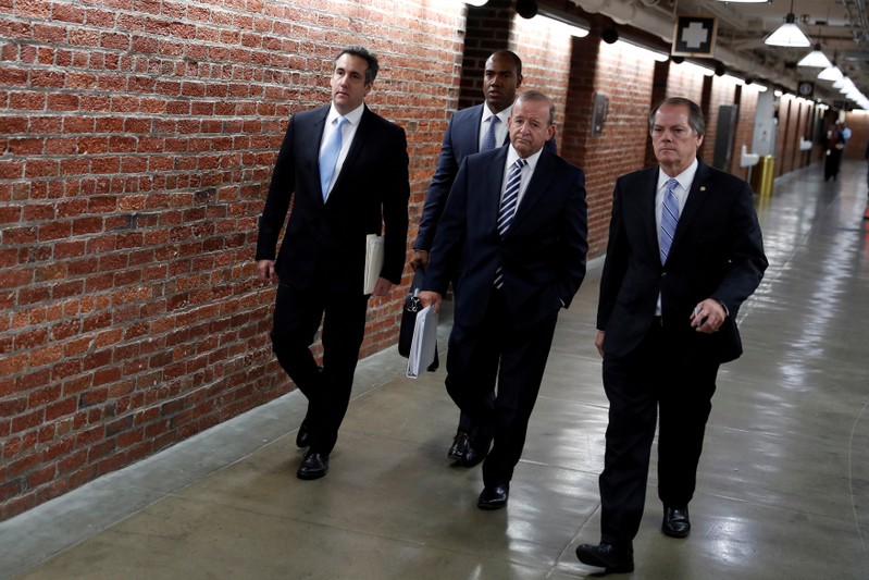 FILE PHOTO: Cohen arrives with his attorney Ryan and Senate Intelligence Committee staffer Wolfe on Capitol Hill in Washington