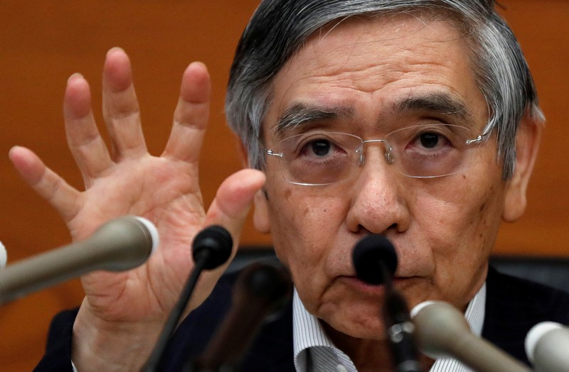 BOJ Governor Kuroda gestures during a news conference at the BOJ headquarters in Tokyo