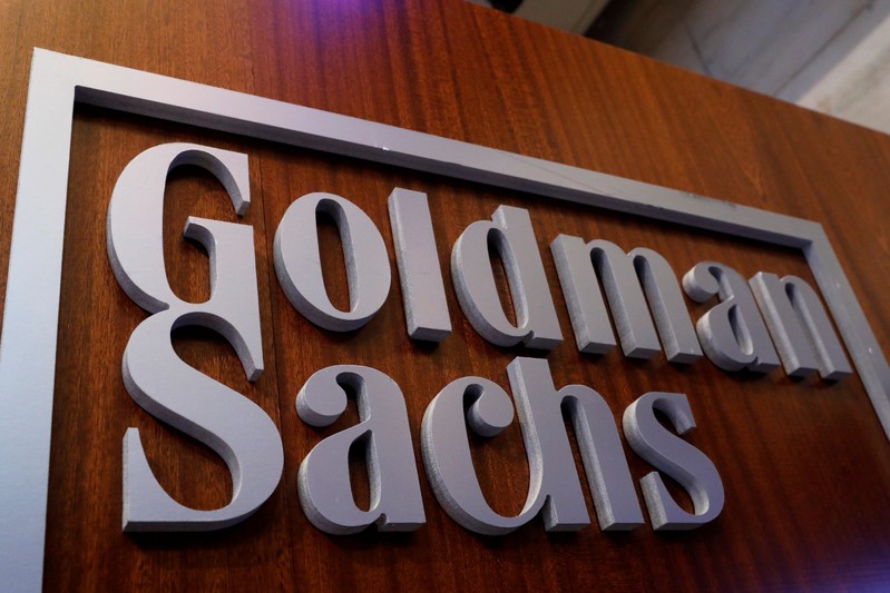 A Goldman Sachs sign is displayed inside the company's post on the floor of the NYSE in New York