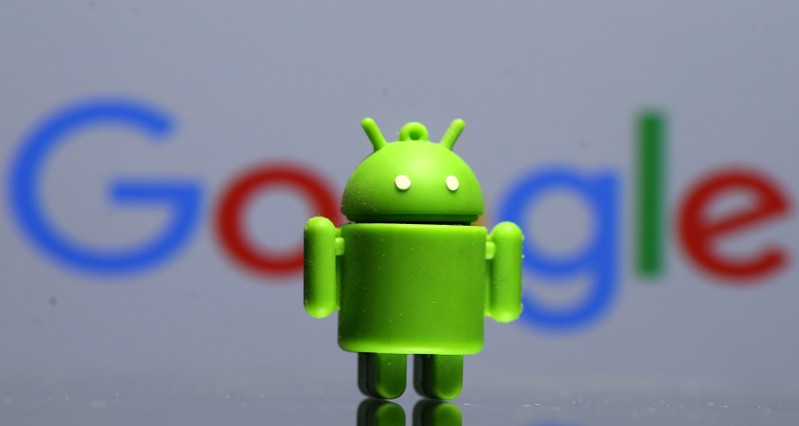 FILE PHOTO: A 3D printed Android mascot in front of a Google logo