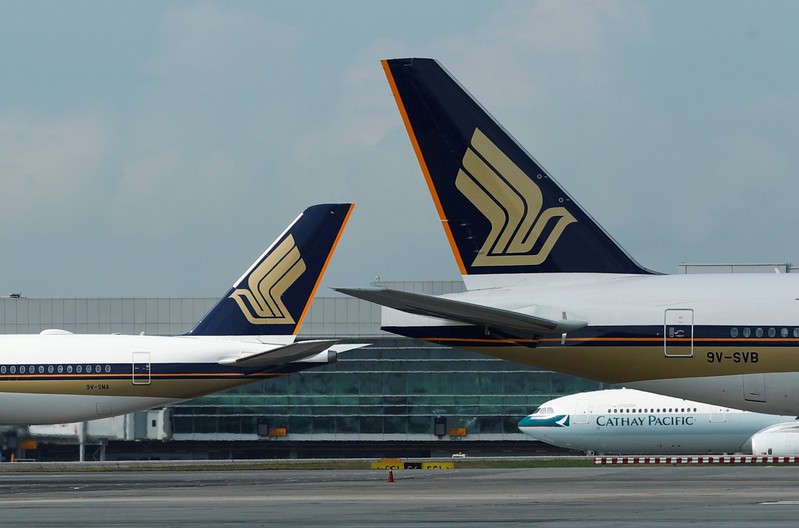Singapore Airlines planes are pictured on the tarmac at Changi Airport