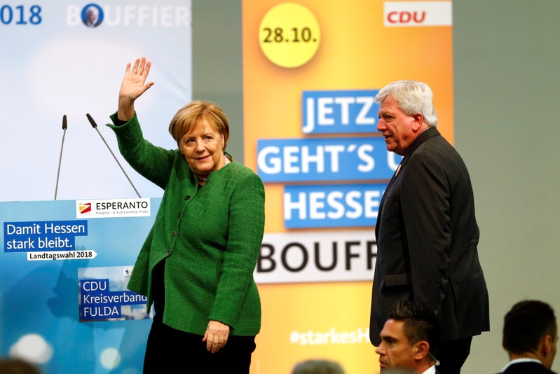 FILE PHOTO - Hesse State Prime Minister Volker Bouffier and German Chancellor Angela Merkel attend the final campaign rally prior to the upcoming state election, in Fulda