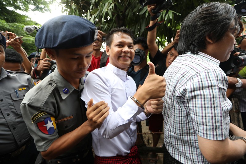 Phyo Wai Win, a reporter at Eleven Media arrives after being detained at Tamwe court in Yangon