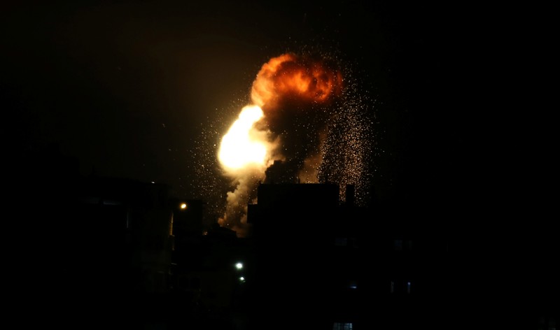 An explosion is seen during Israeli air strikes in the southern Gaza Strip