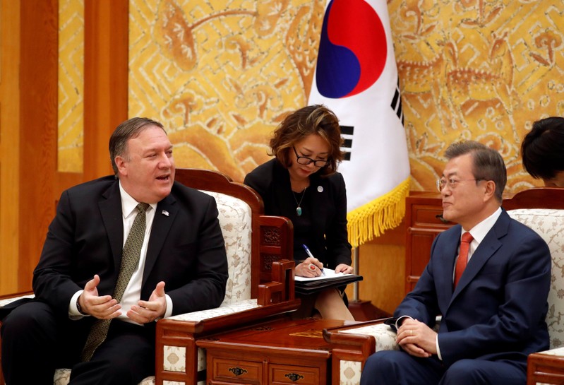 U.S. Secretary of State Mike Pompeo talks with South Korean President Moon Jae-in during their meeting at the presidential Blue House in Seoul