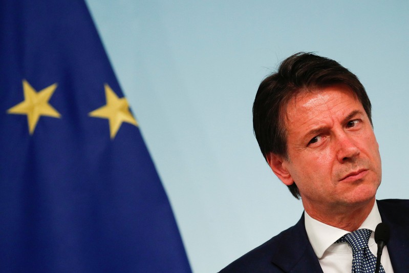 FILE PHOTO: Italy's Prime Minister Giuseppe Conte attends a news conference with Interior Minister Matteo Salvini after to approve a new decree of the measures on immigration and security at Chigi Palace in Rome
