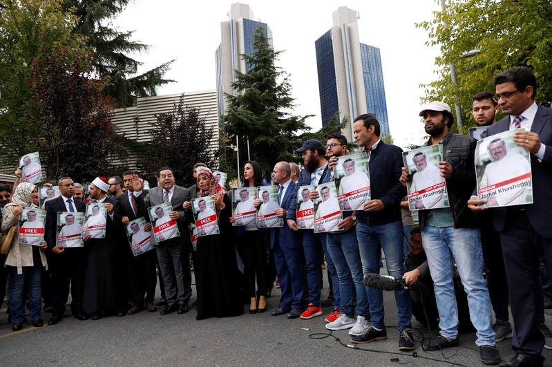 FILE PHOTO: Human rights activists and friends of Saudi journalist Khashoggi hold his pictures during a protest outside the Saudi Consulate in Istanbul
