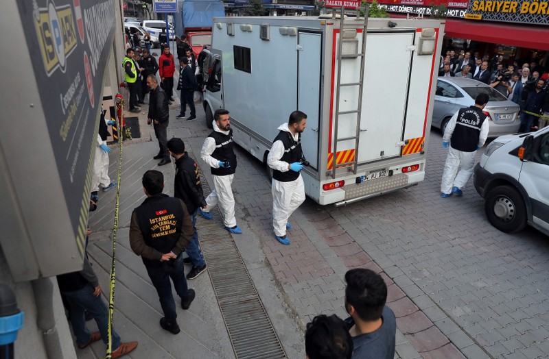 Turkish police forensic experts arrive at a car park where a vehicle belonging to Saudi Arabia's consulate was found, in Istanbul