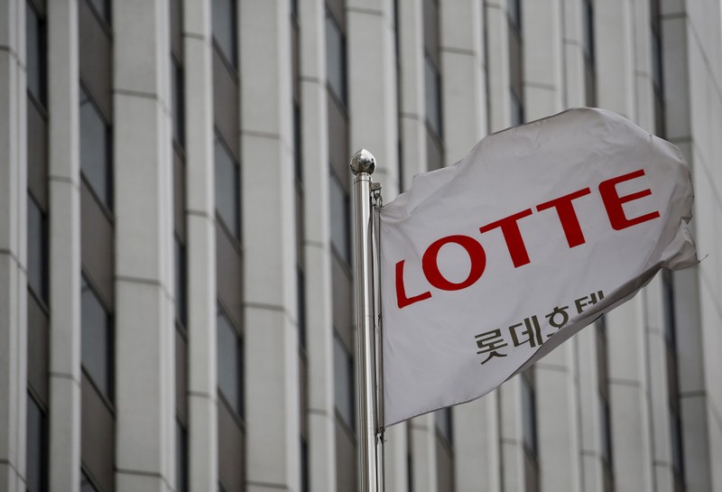 A flag bearing the logo of Lotte Hotel flutters at a Lotte Hotel in Seoul