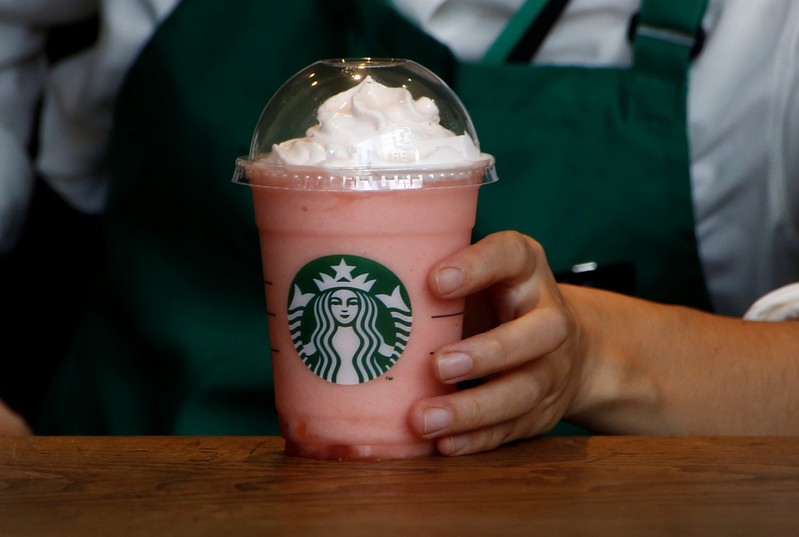 A waitress prepares a beverage at a branch of Starbucks coffee in Tokyo