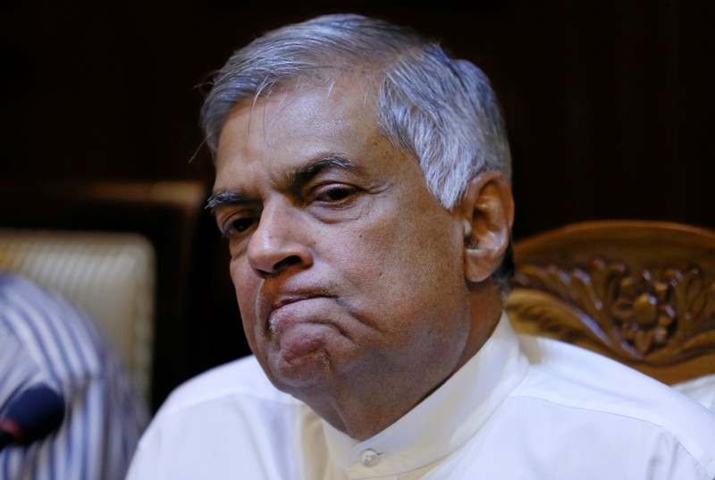 FILE PHOTO: Sri Lanka's sacked Prime Minister Wickremesinghe reacts during a news conference with Sri Lanka's Foreign Media Association in Colombo