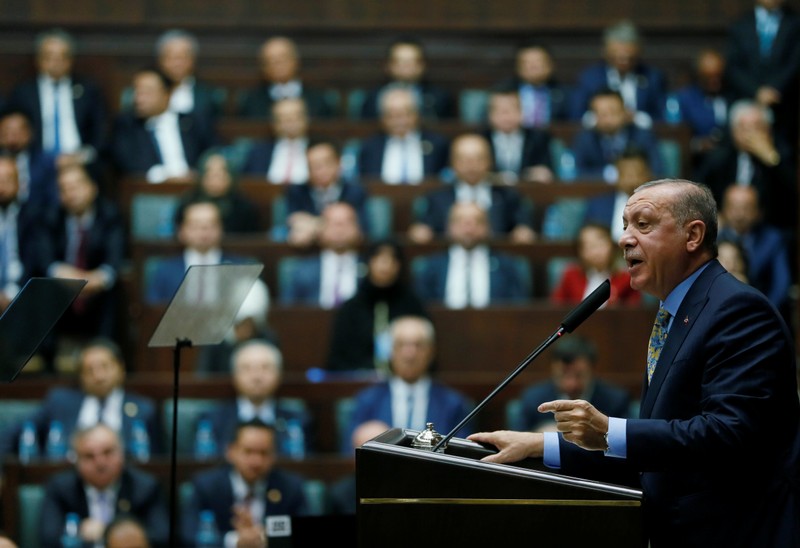 Turkish President Erdogan addresses members of parliament from his ruling AK Party during a meeting at the Turkish parliament in Ankara