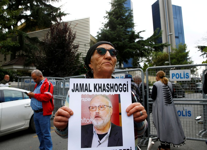A human rights activist holds picture of Saudi journalist Jamal Khashoggi during a protest outside the Saudi Consulate in Istanbul