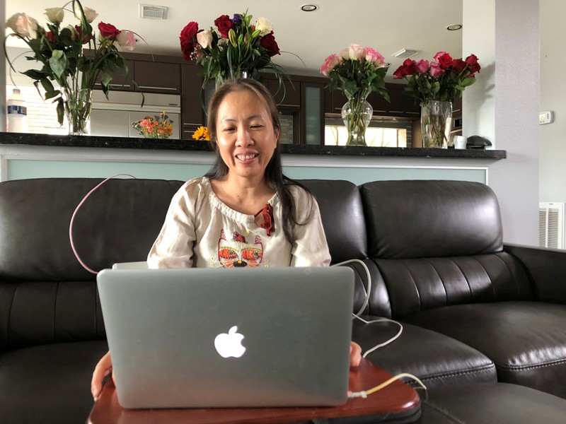 Handout photo of Vietnamese dissident Nguyen Ngoc Nhu Quynh speaking with a reporter during a video conference on her laptop computer in Houston