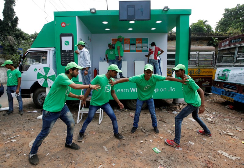WhatsApp-Reliance Jio representatives perform in a street play during a drive by the two companies to educate users, on the outskirts of Kolkata