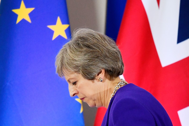 FILE PHOTO: Britain's Prime Minister Theresa May leaves a news conference at the European Union leaders summit in Brussels