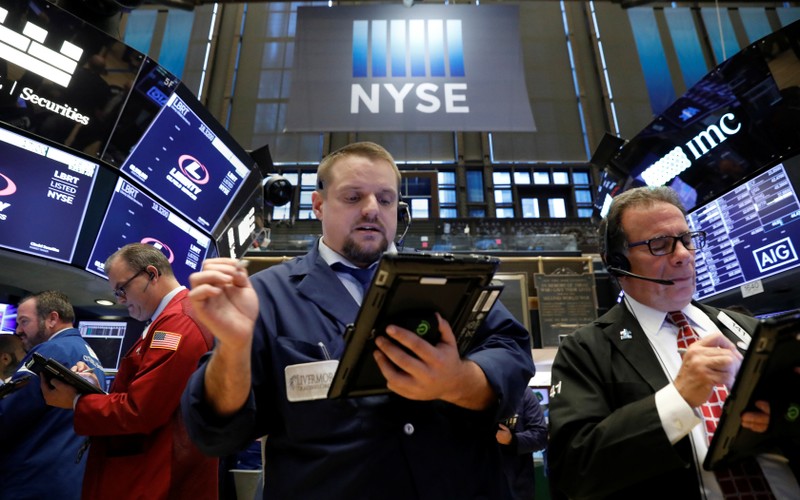 Traders works on the floor of the New York Stock Exchange in New York