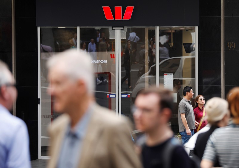 People walk past a Westpac bank branch in Sydney, Australia