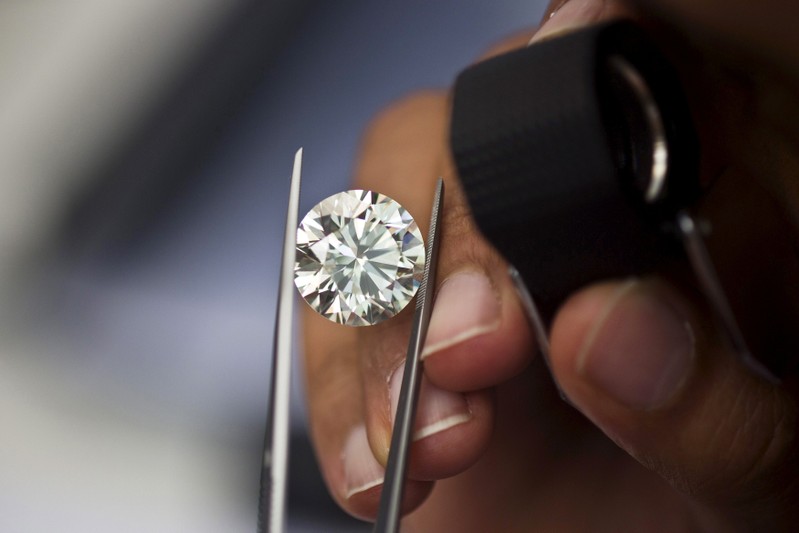 FILE PHOTO: A trader inspects a diamond at Israel's Diamond Exchange near Tel Aviv