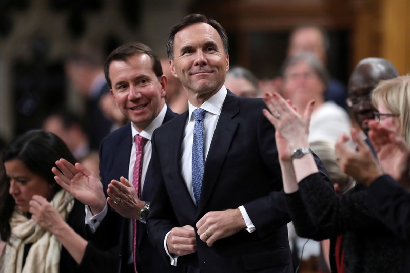 Canada's Finance Minister Bill Morneau receives a standing ovation as he stands to deliver the Fall Economic Statement in Ottawa