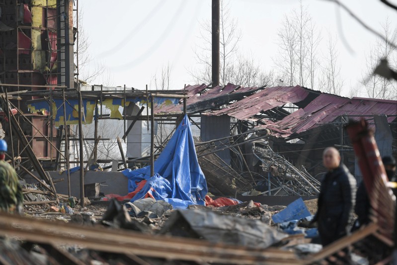Damaged houses are seen on the following day at the site of an explosion at a machinery plant, in Jilin