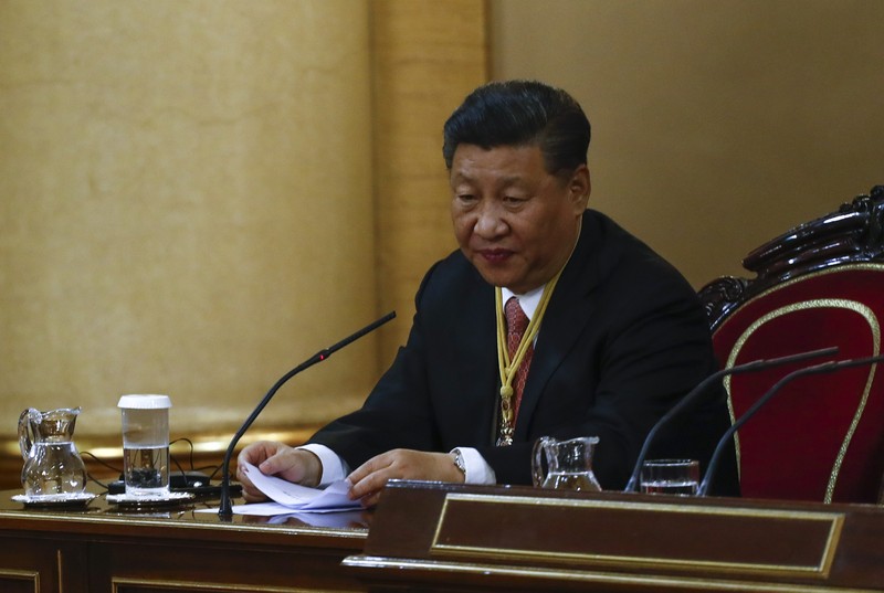 China's President Xi Jinping delivers a speech during a visit to the Senate as part of a state visit in Madrid