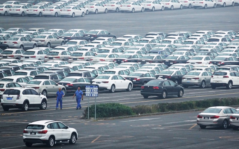 Newly manufactured cars are seen at the automobile terminal in the port of Dalian, Liaoning