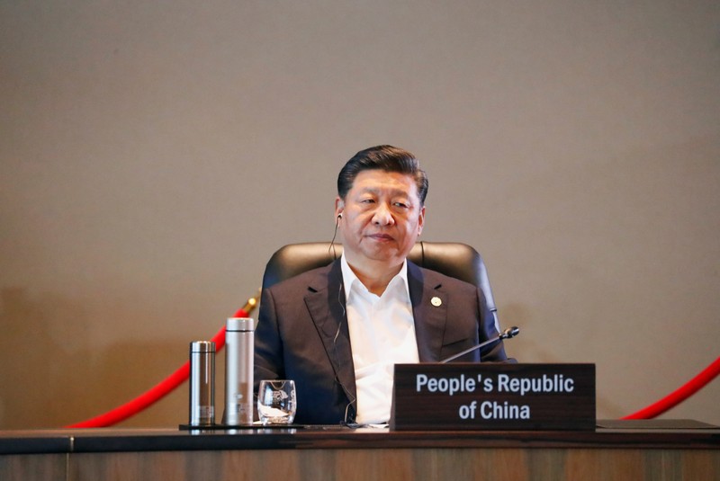 FILE PHOTO - China's President Xi Jinping attends the retreat session during the APEC Summit in Port Moresby, Papua New Guinea