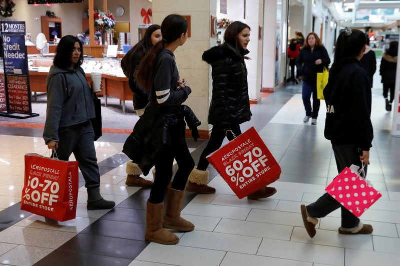 People shop during the Black Friday sales shopping event at Roosevelt Field Mall in Garden City, New York