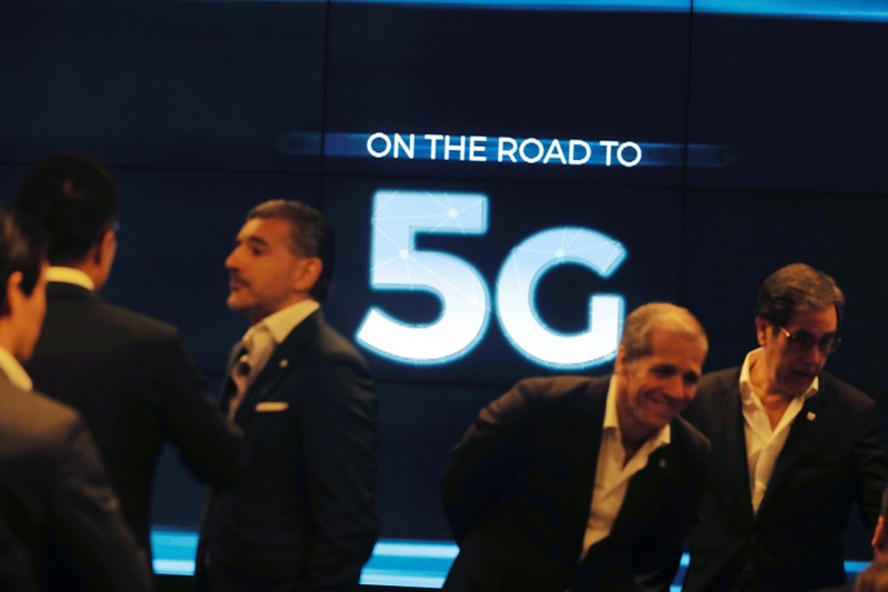 People speak before the first demonstration of the technology 5G in Lisbon