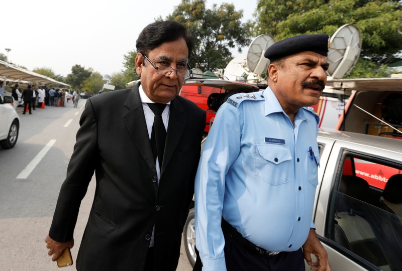 FILE PHOTO: Saiful Mulook (L) the lawyer of Christian woman sentenced to death for blasphemy against Islam, leaves after the Court overturned the conviction, in Islamabad
