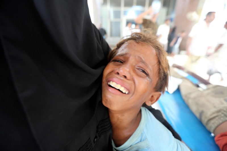 FILE PHOTO: Boy cries after his brother was injured in strike near al-Thawra Hospital in Hodeidah