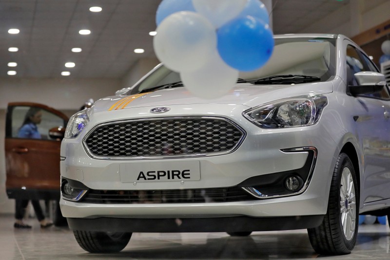 A new Ford Aspire car is on display for sale inside a showroom in New Delhi
