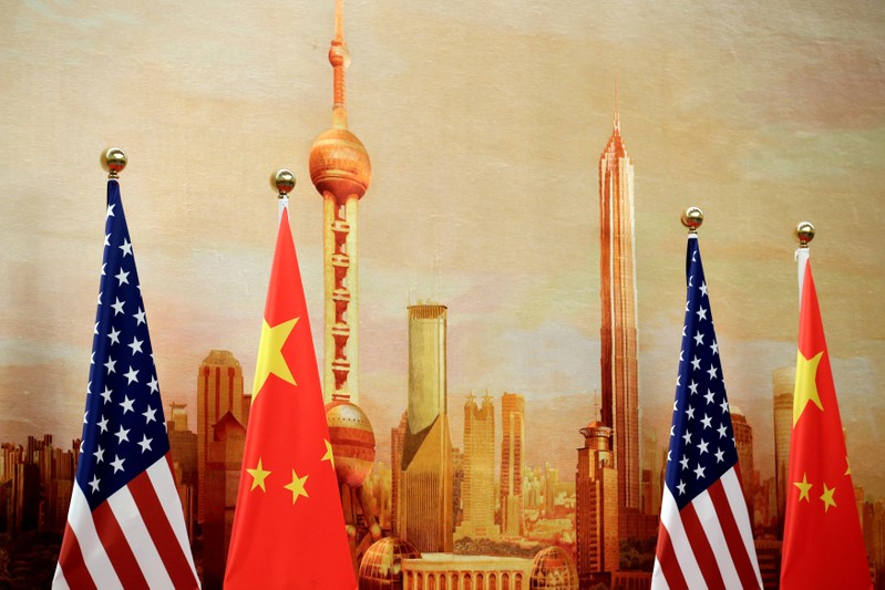 FILE PHOTO: U.S. and Chinese flags are placed for a joint news conference in Beijing