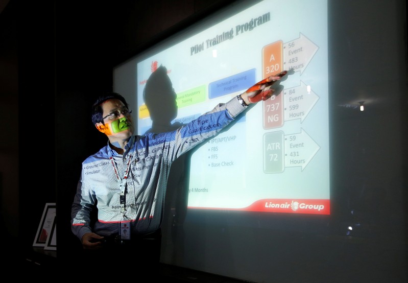 FILE PHOTO: General Manager of Lion Air's Angkasa Training Center, Capt. Dibyo Soesilo gestures as he explains the general training curriculum to the media at the airline group's training center near Jakarta