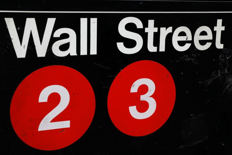 FILE PHOTO - A sign for the Wall Street subway station is seen in the financial district in New York