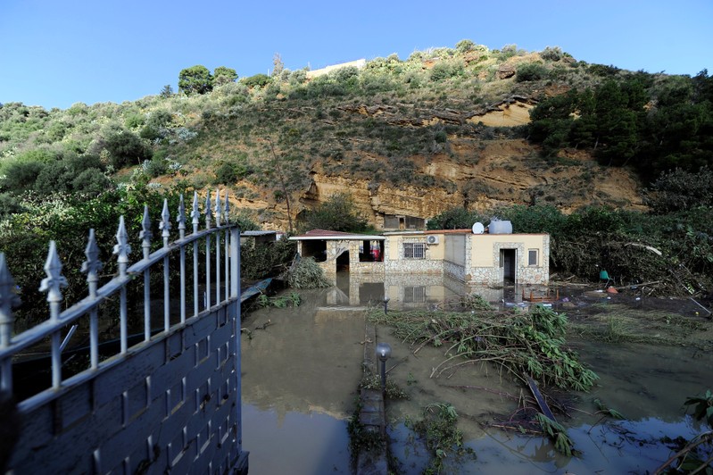 A general view shows a partially submerged house in Casteldaccia
